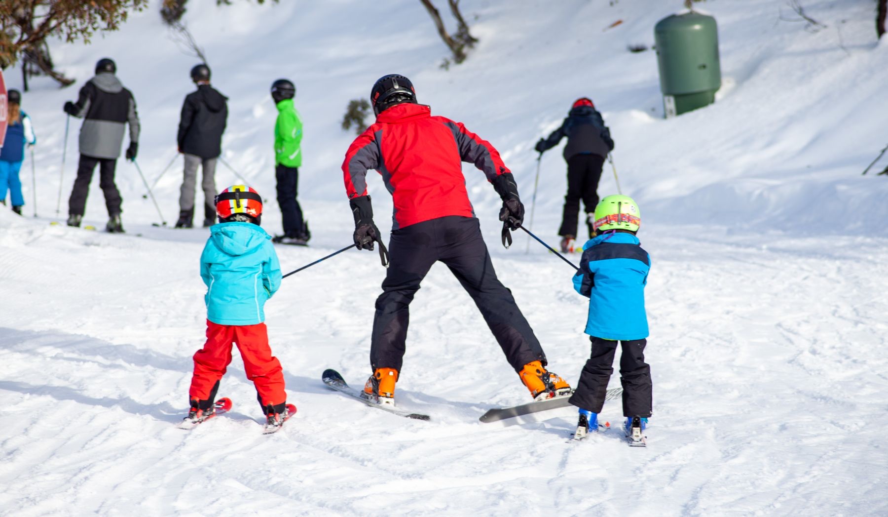 Children in ski gear during a lesson