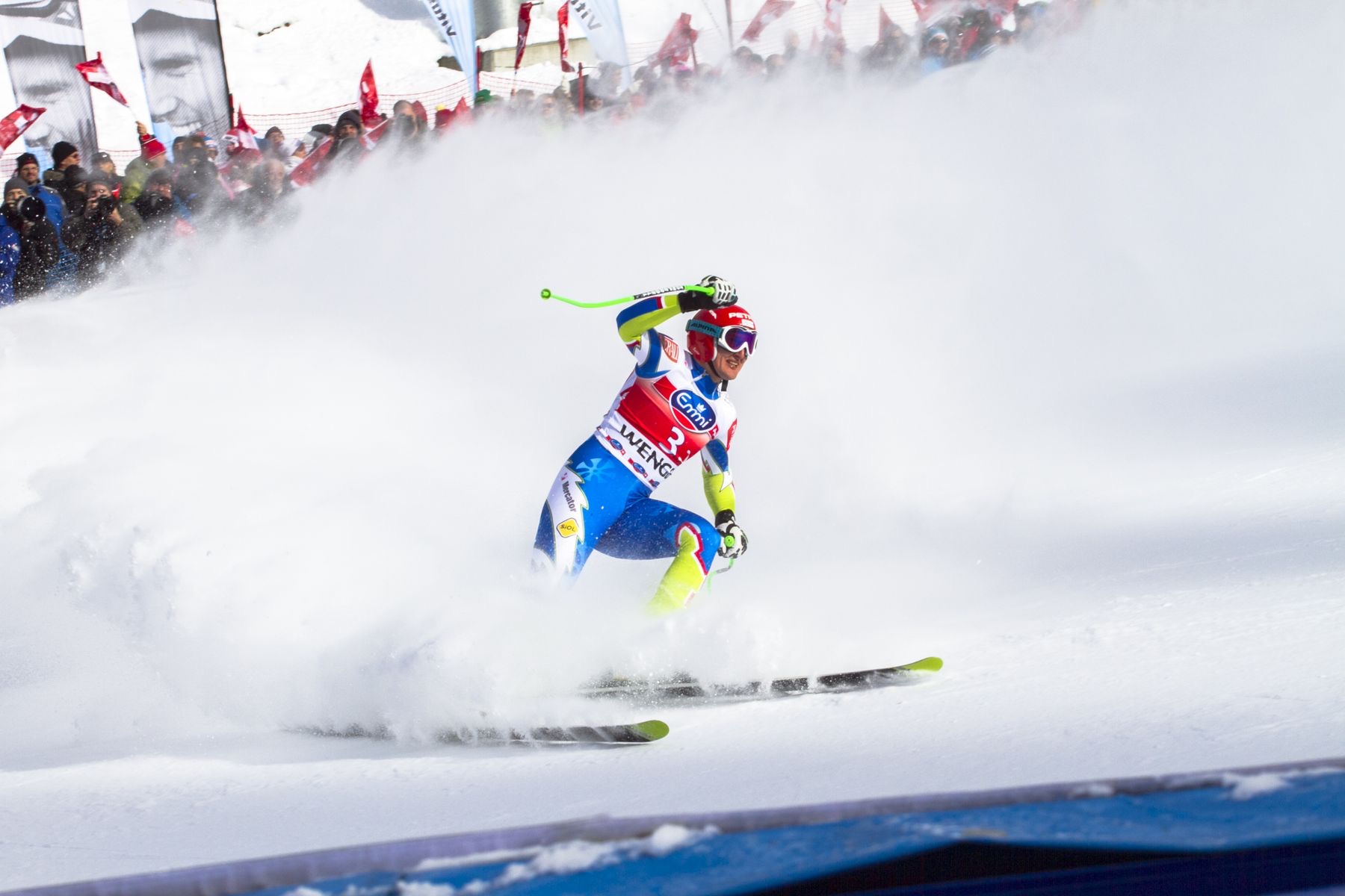 A ski racer passing a slalom gate