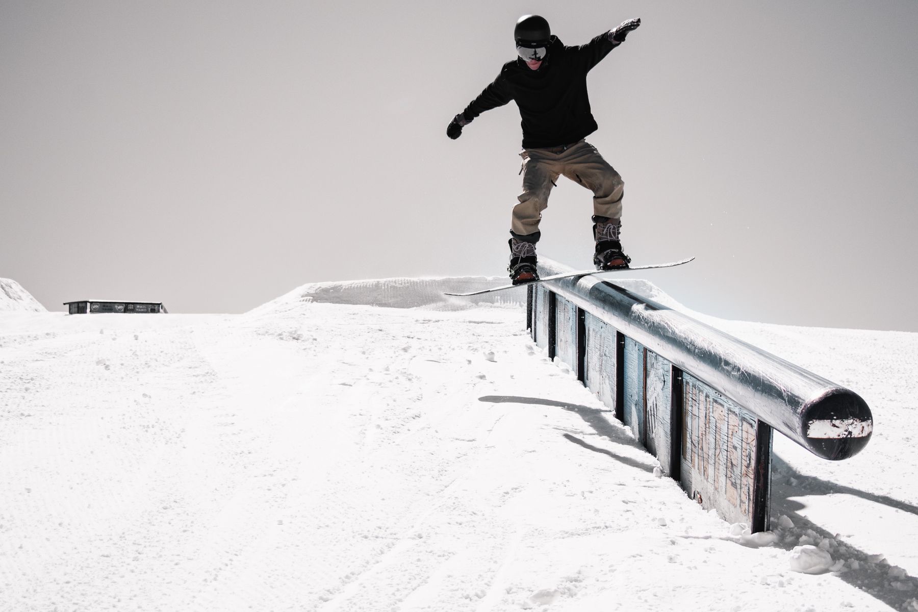A snowboarder mid turn